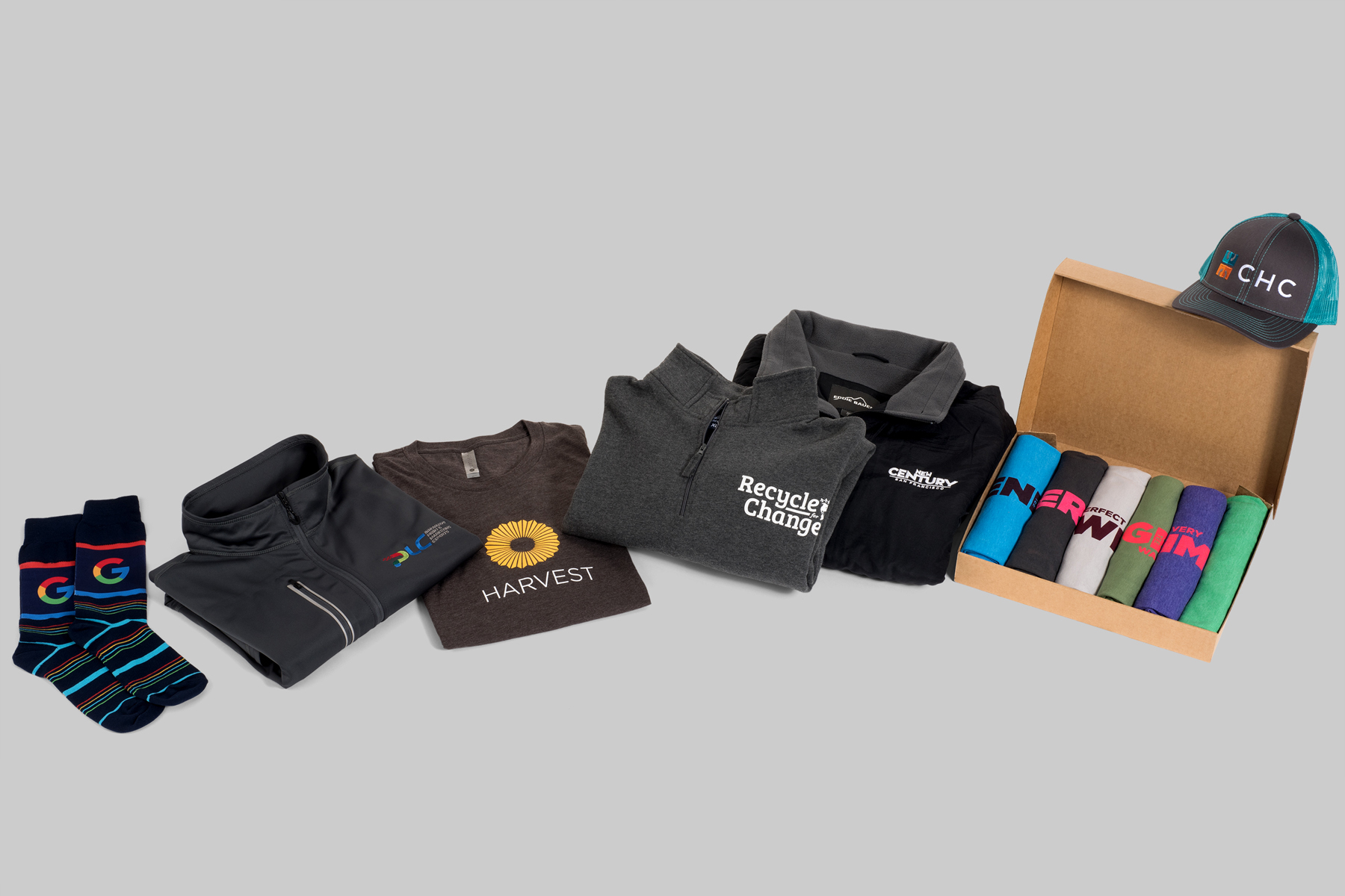 Branded apparel and merch kit by PLC Print: socks, jackets, tees, hoodies, cap and a boxed t-shirt set