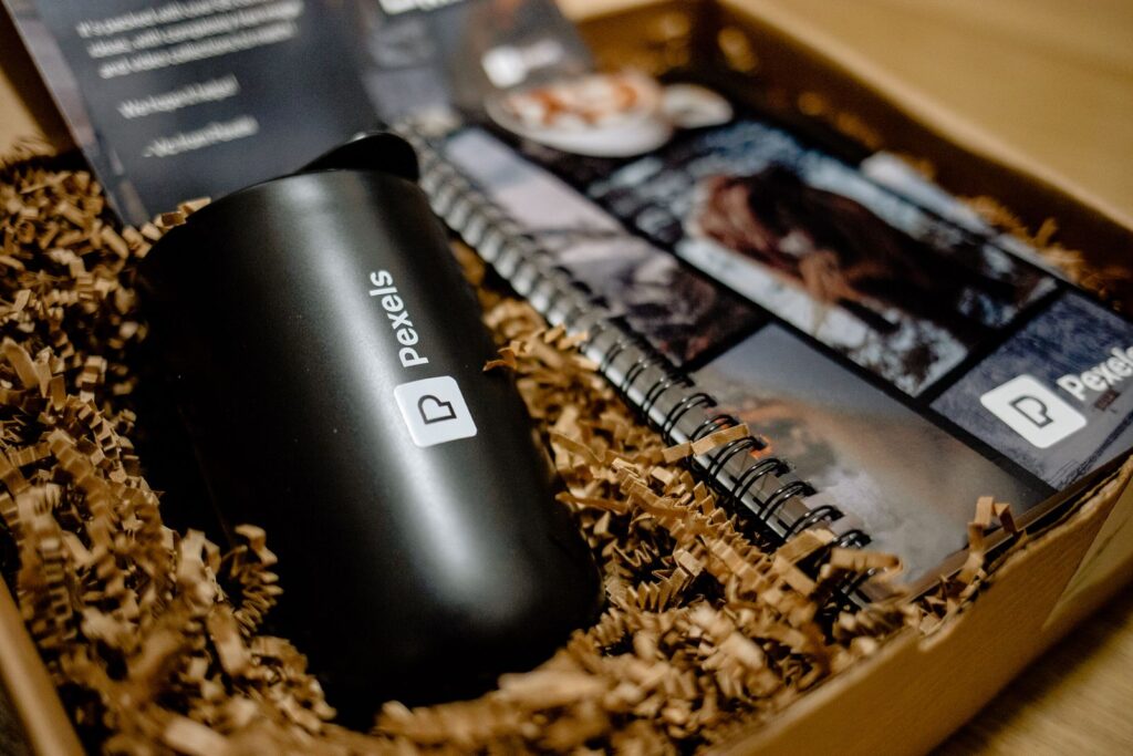 Marketing fulfillment services example: a branded welcome kit box with a bottle and notebook, ready to ship