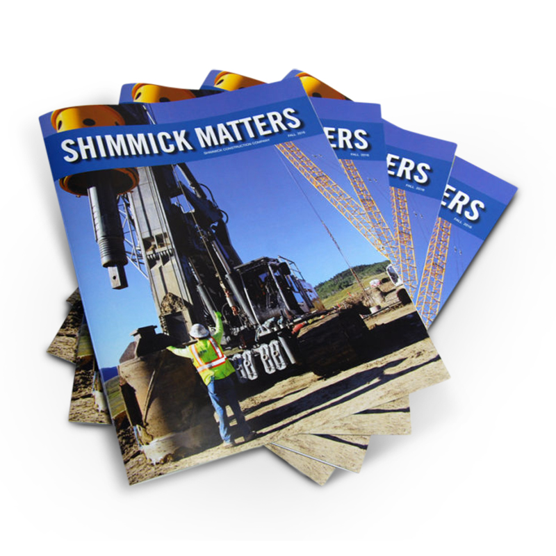 Offset printed Shimmick Matters magazines, fanned copies with a construction cover photo